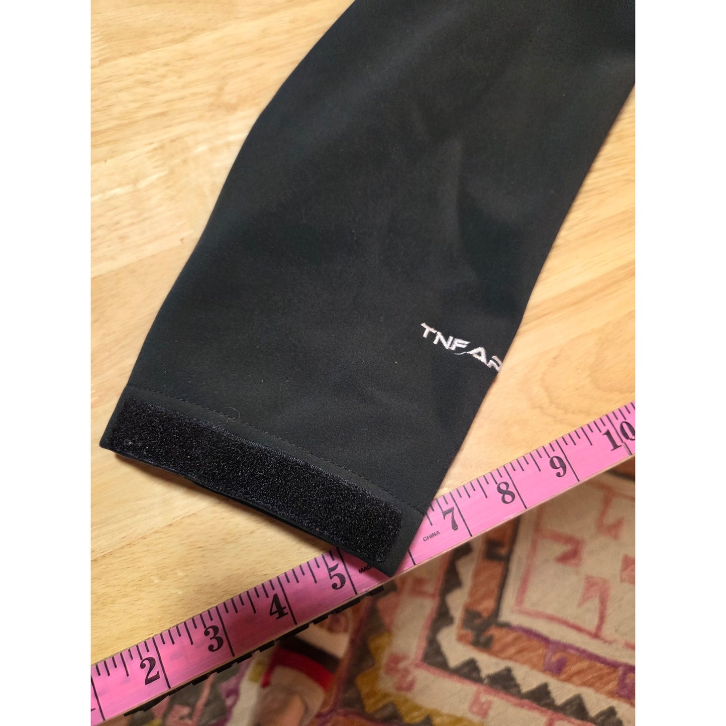 Black North Face jackets missing straps on sleeves but good condition LRG