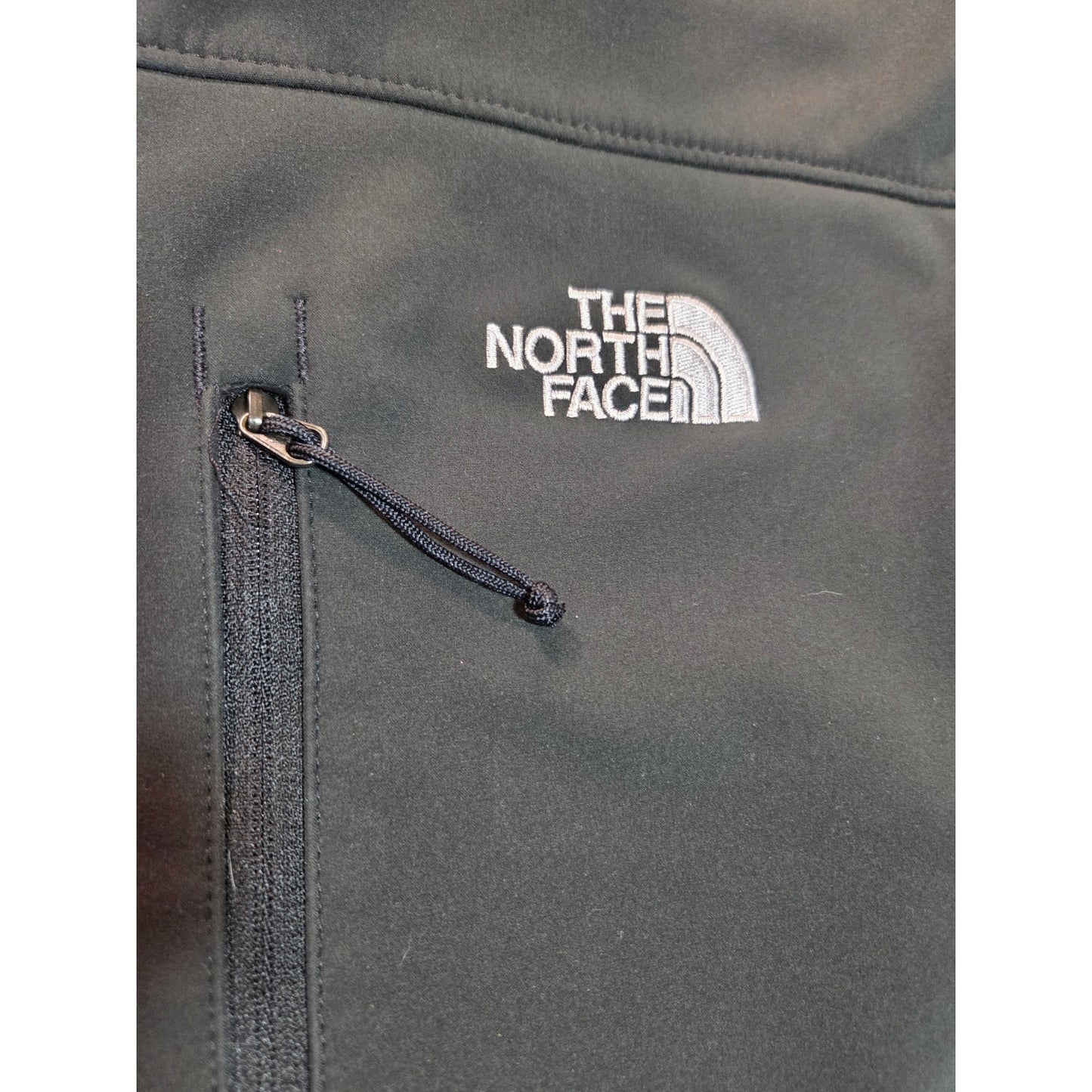 Black North Face jackets missing straps on sleeves but good condition LRG
