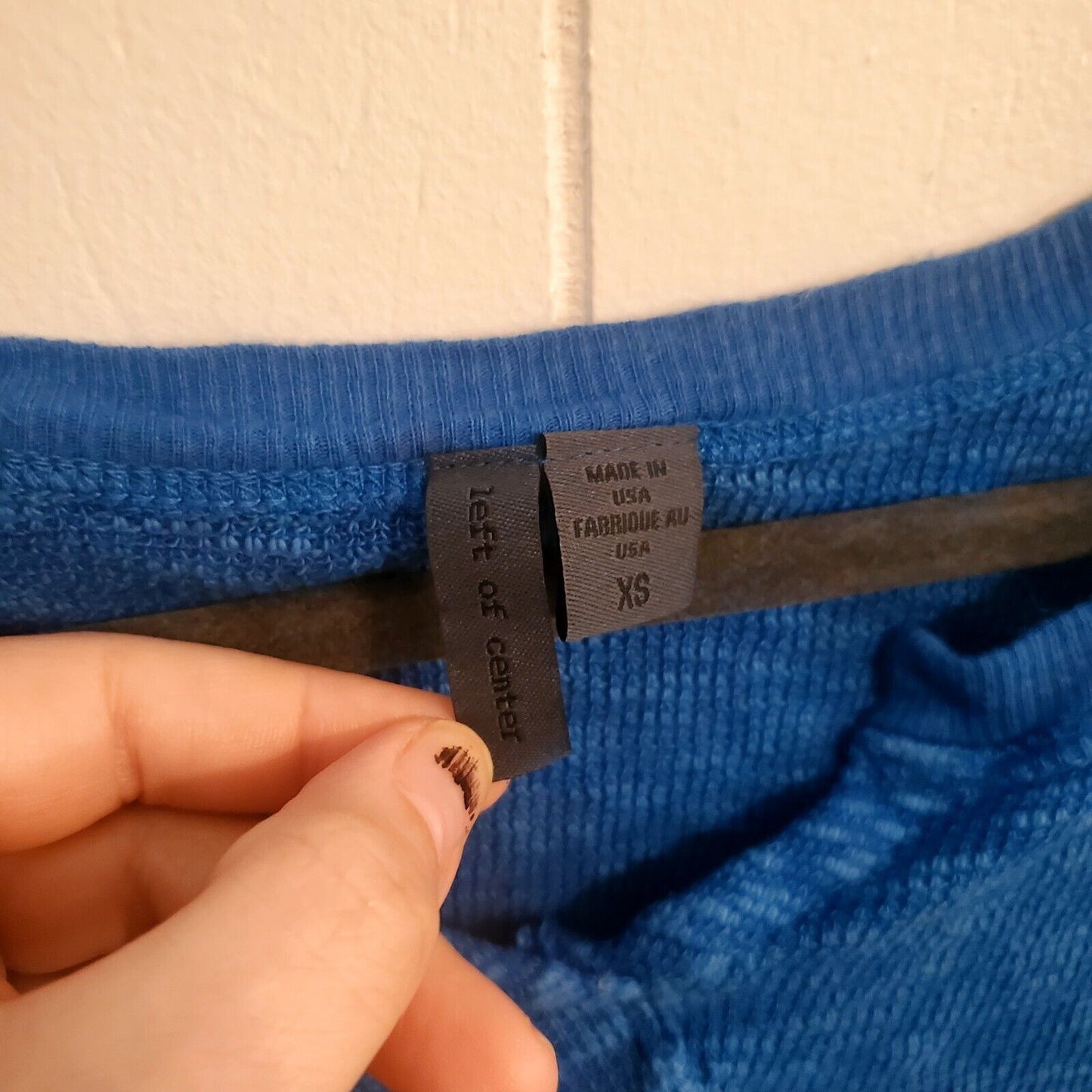 Anthropologie Left of Center Womens top XS Ruffle hem long sleeve Blue(see Hole)