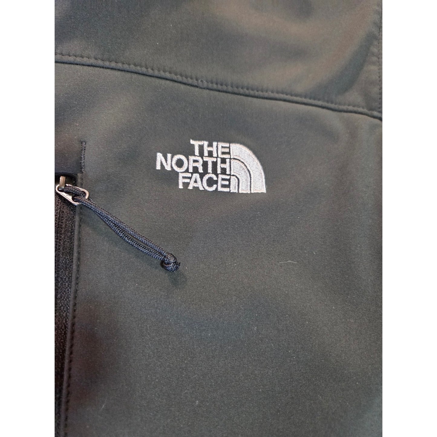 Black North Face jackets missing straps on sleeves but good condition LRG