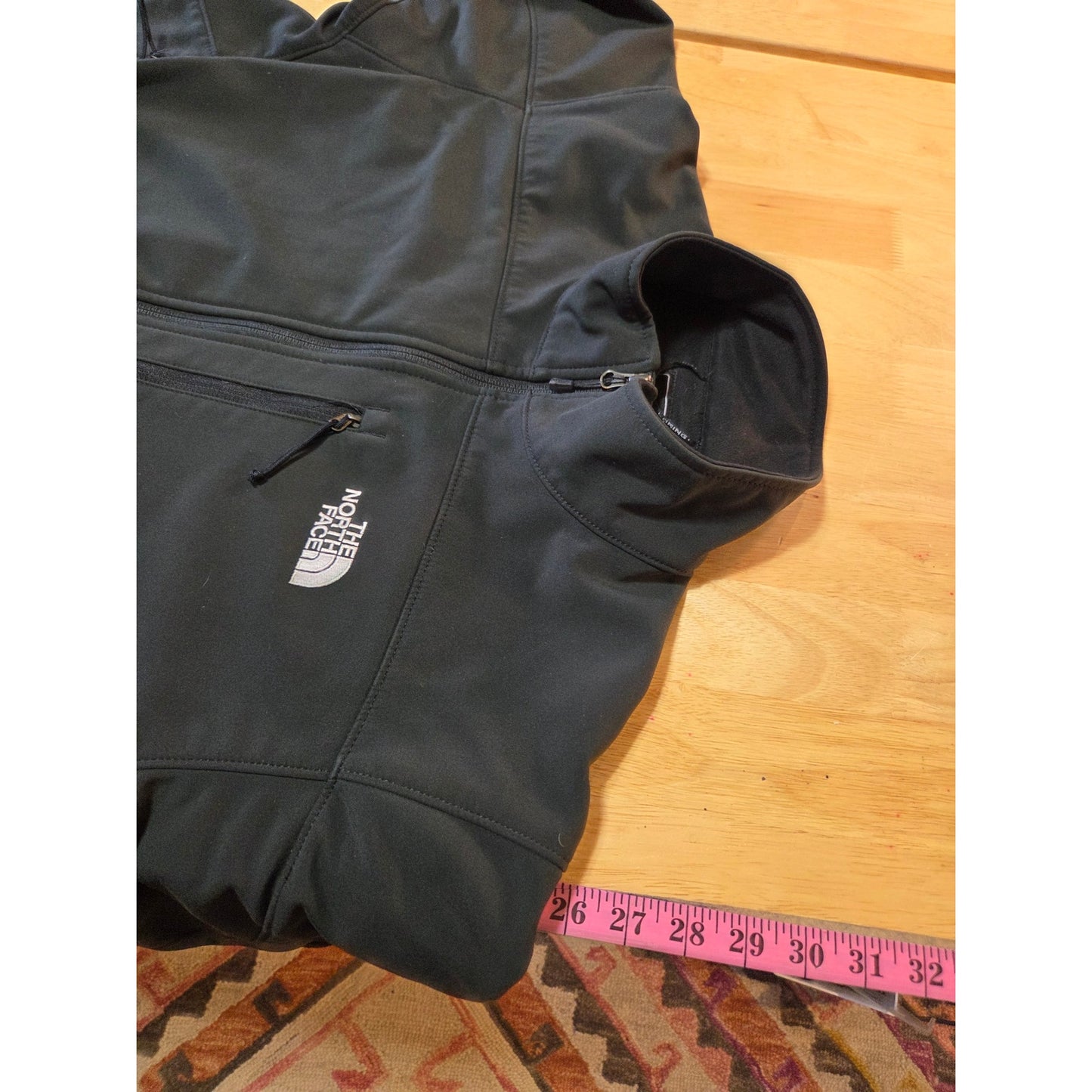 Black North Face jackets missing straps on sleeves but good condition LRG
