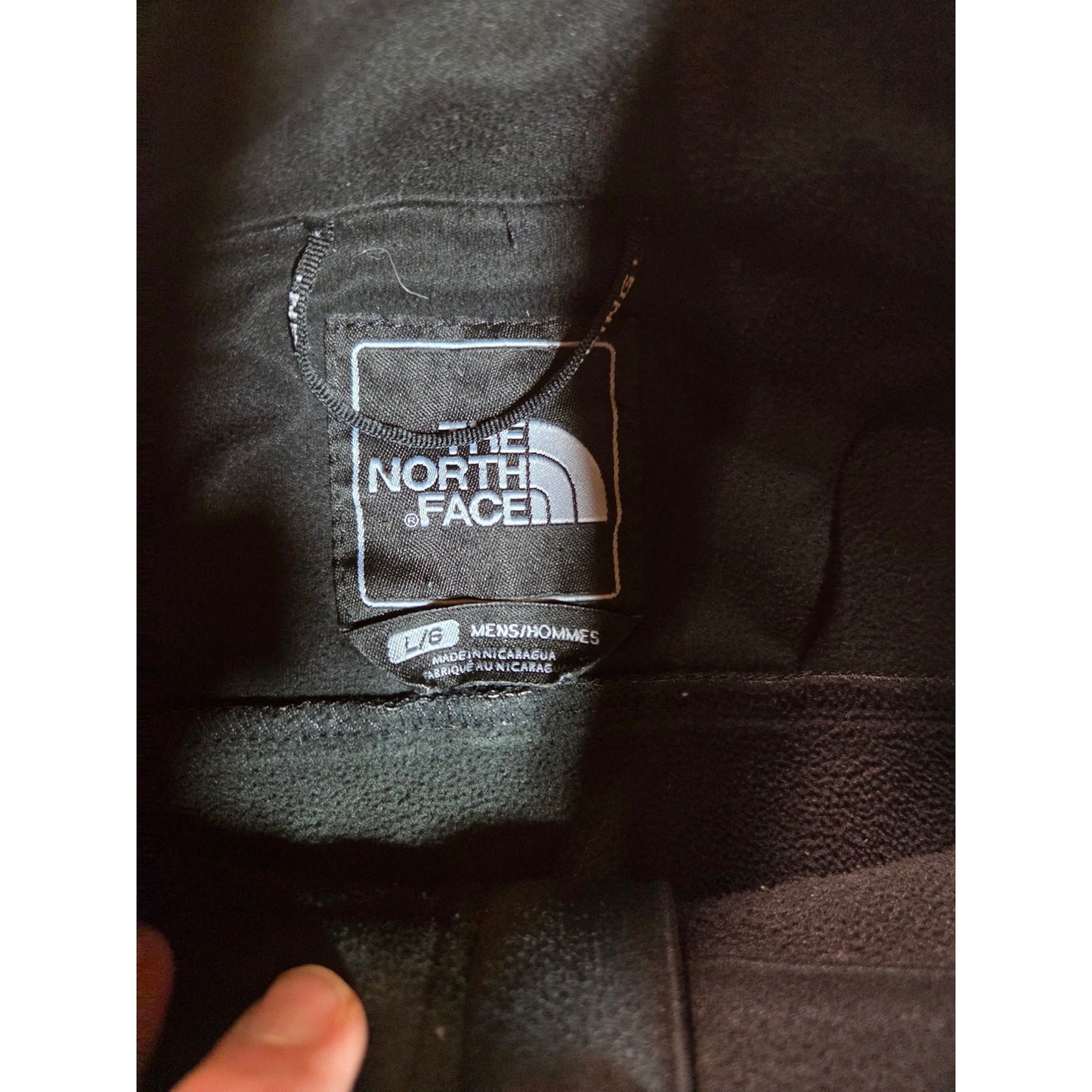 Black North Face jackets missing straps on sleeves but good condition LRG